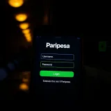 User interface showing the Paripesa login screen with input fields for username and password